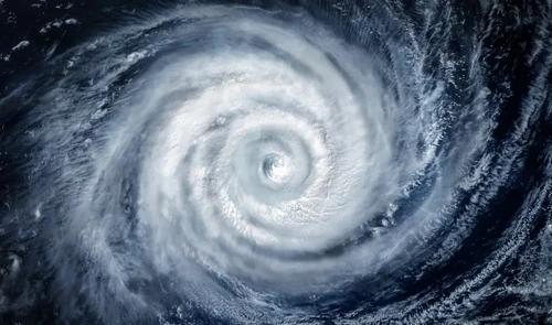 A satellite views a hurricane as it sweeps across the coastal waters.